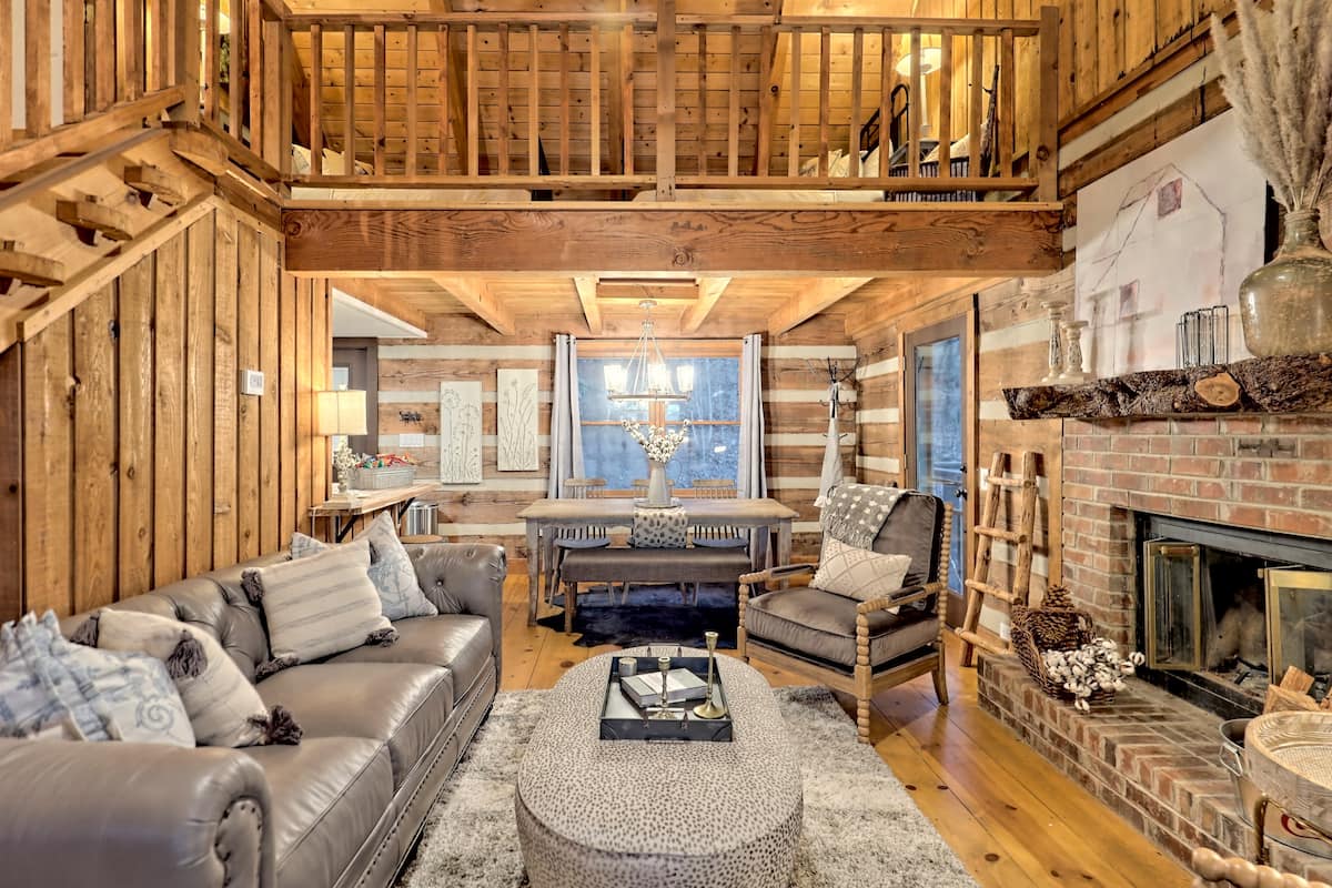 Living room with cathedral ceiling and fireplace